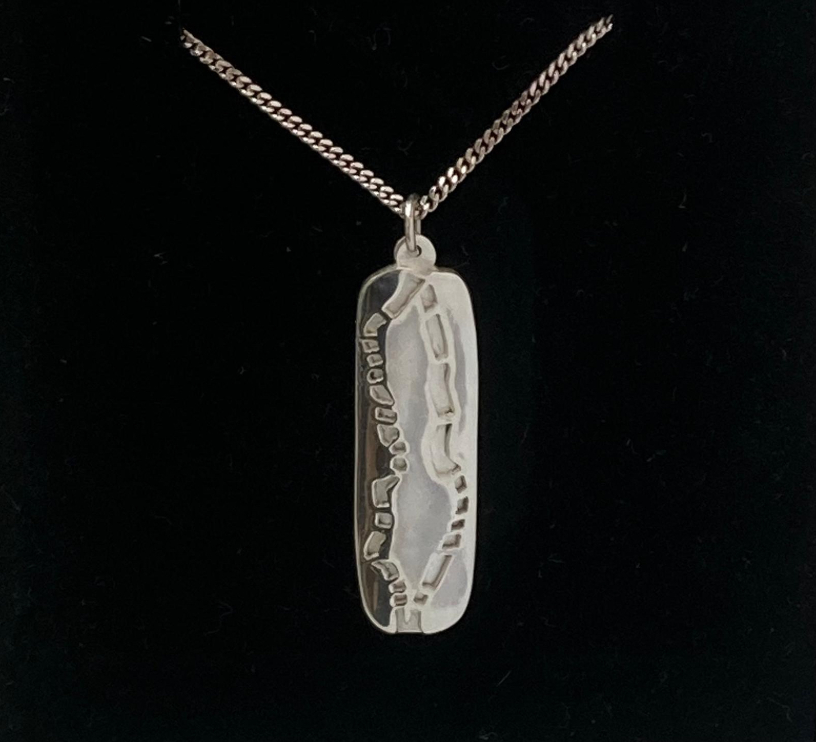 Silver pendant of Cork city and the river Lee