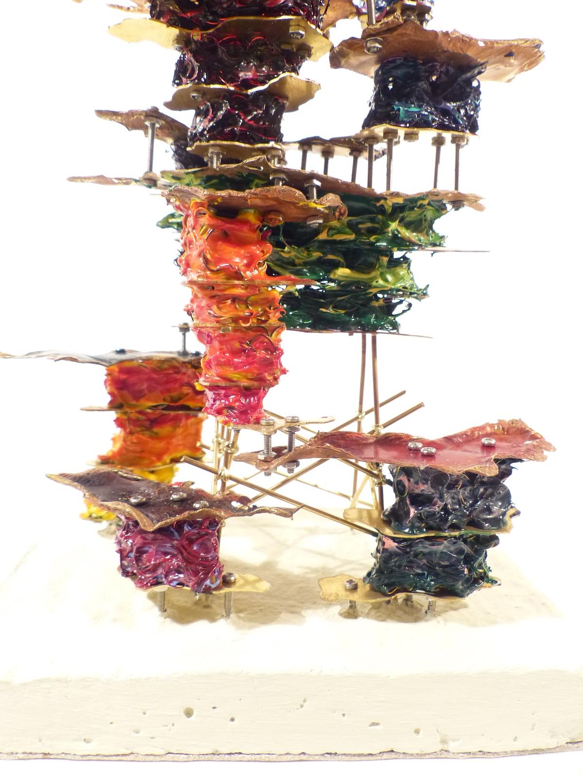 Cracked walnut block filled with brass cells cracked seam close-up