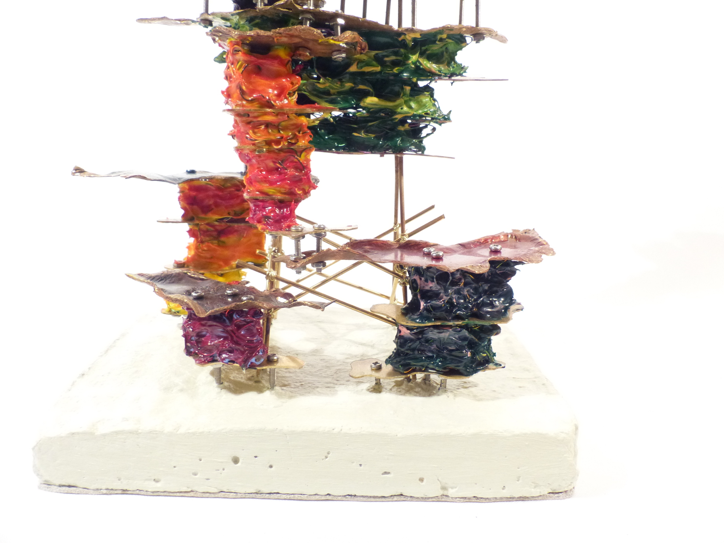 Cracked walnut block filled with brass cells cracked seam close-up