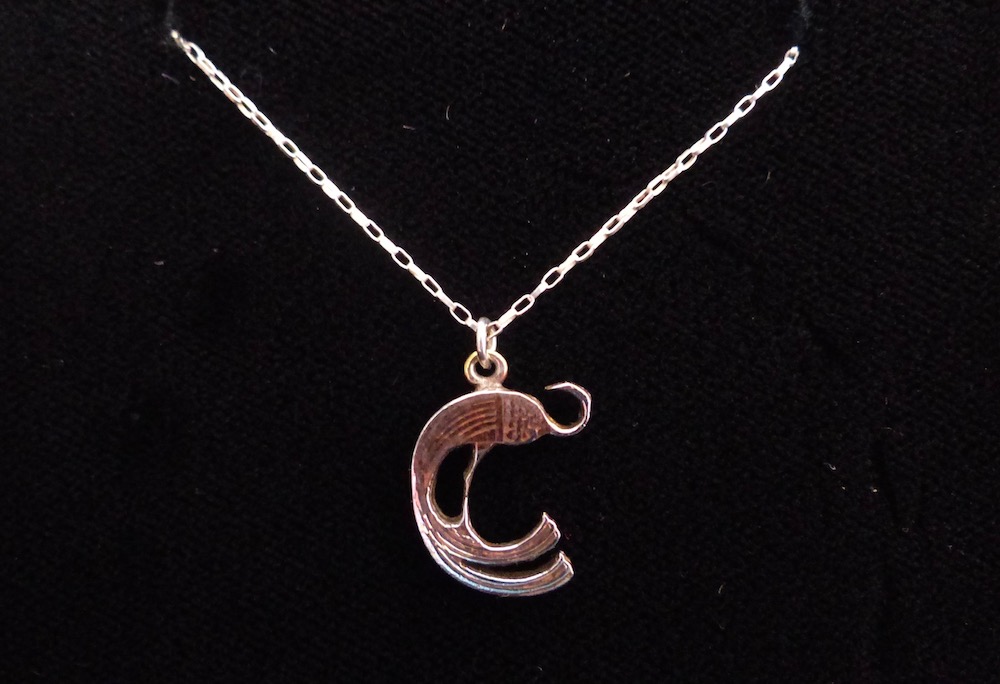 Irish penny peacock cut-out with silver chain front side