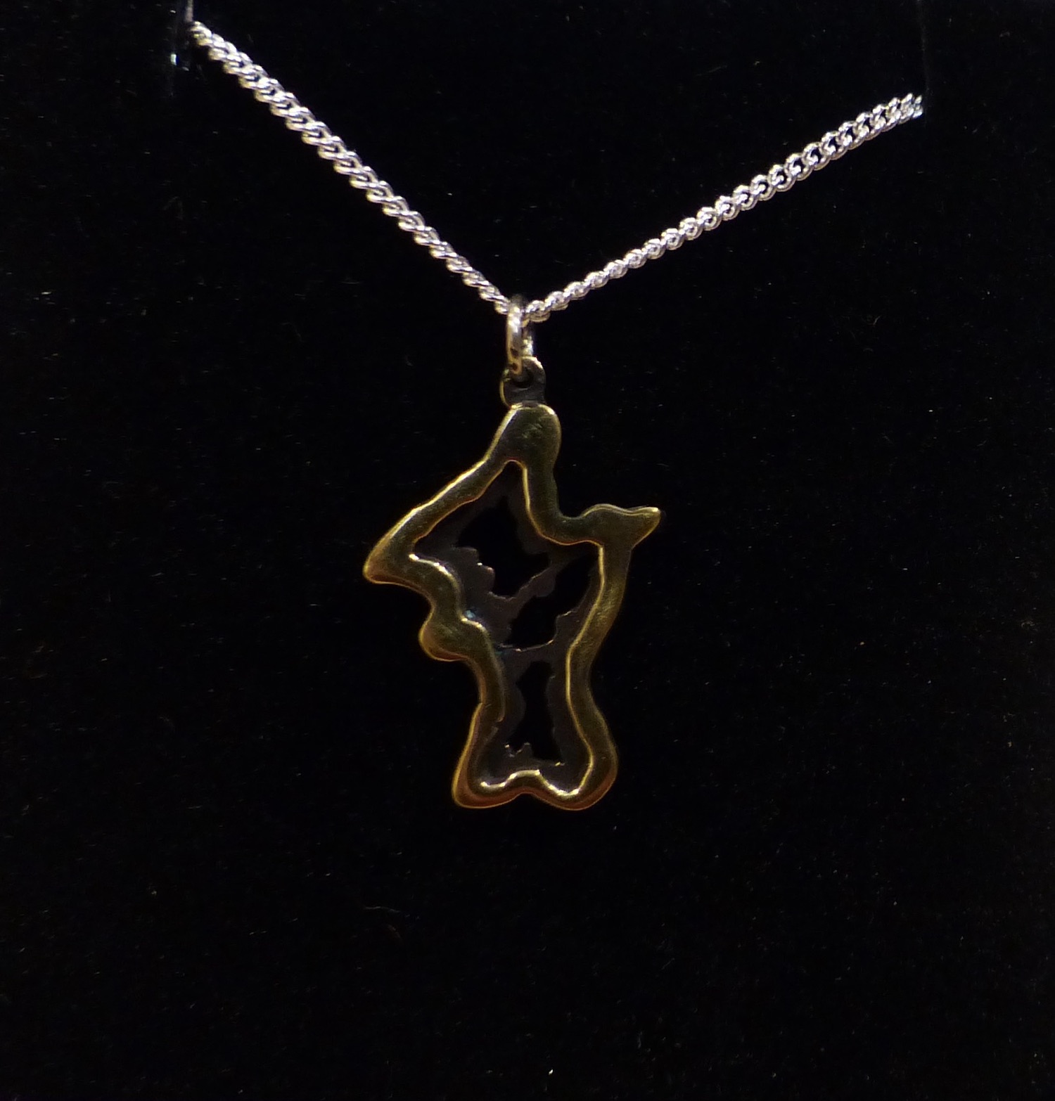 Irish penny peacock cut-out with silver chain front side