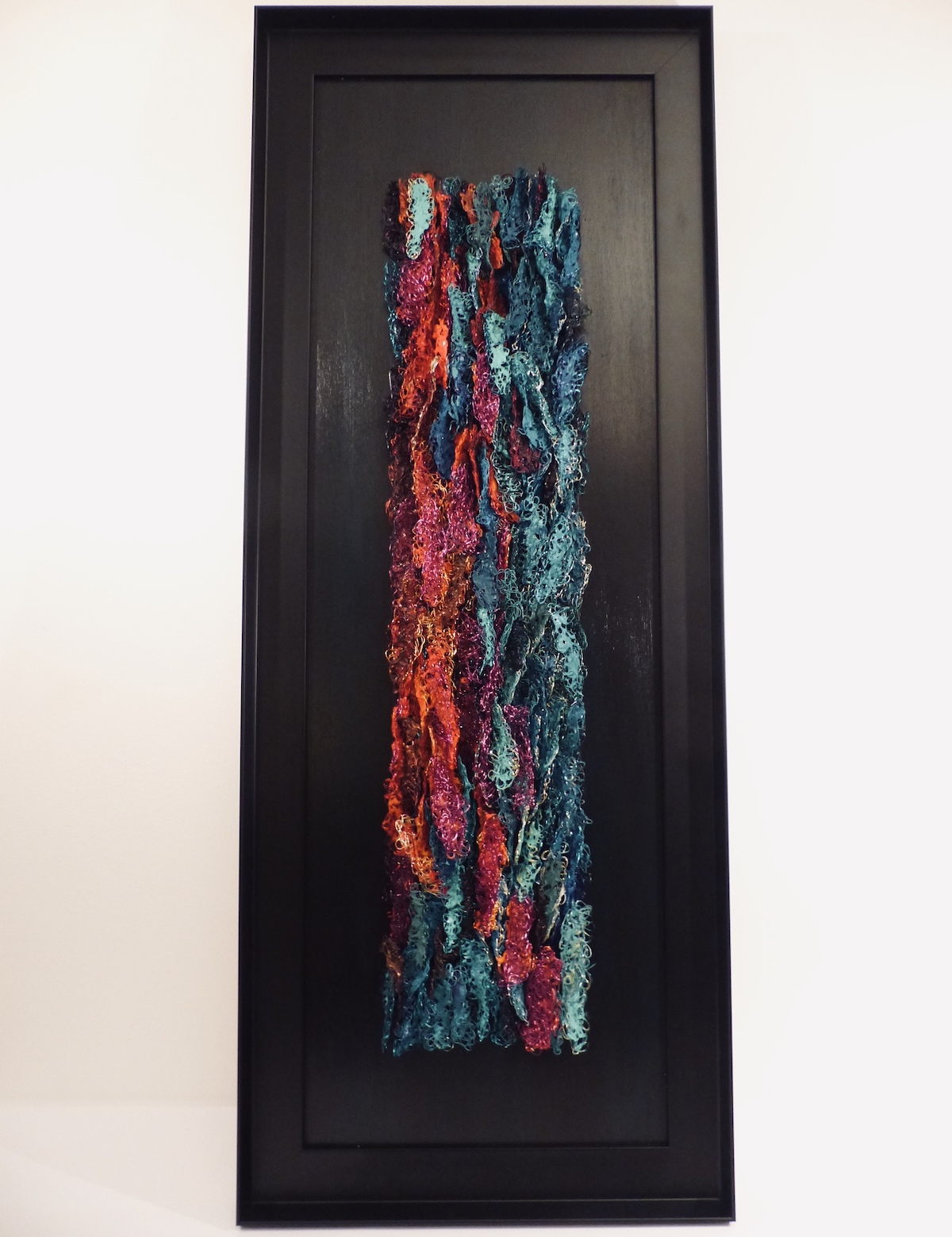 torquoise and orange abstract wire painting